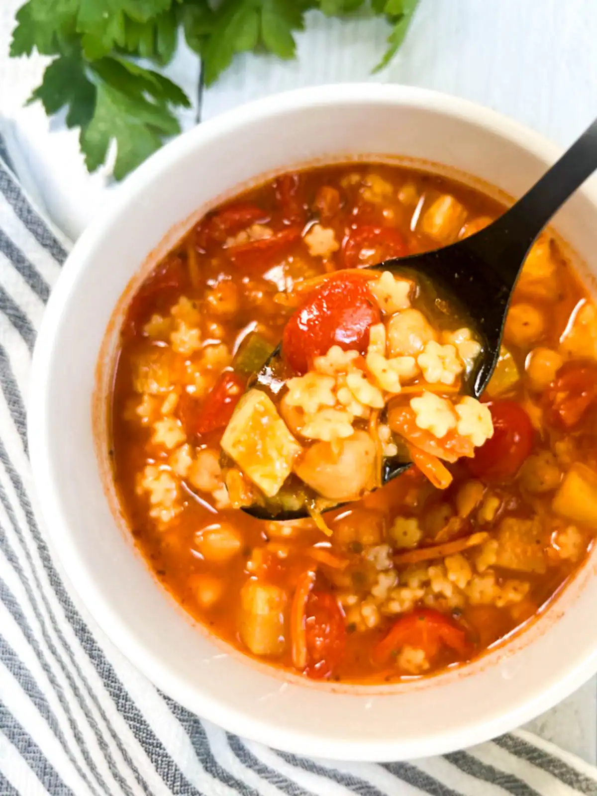 Easy vegan minestrone soup in a white bowl.