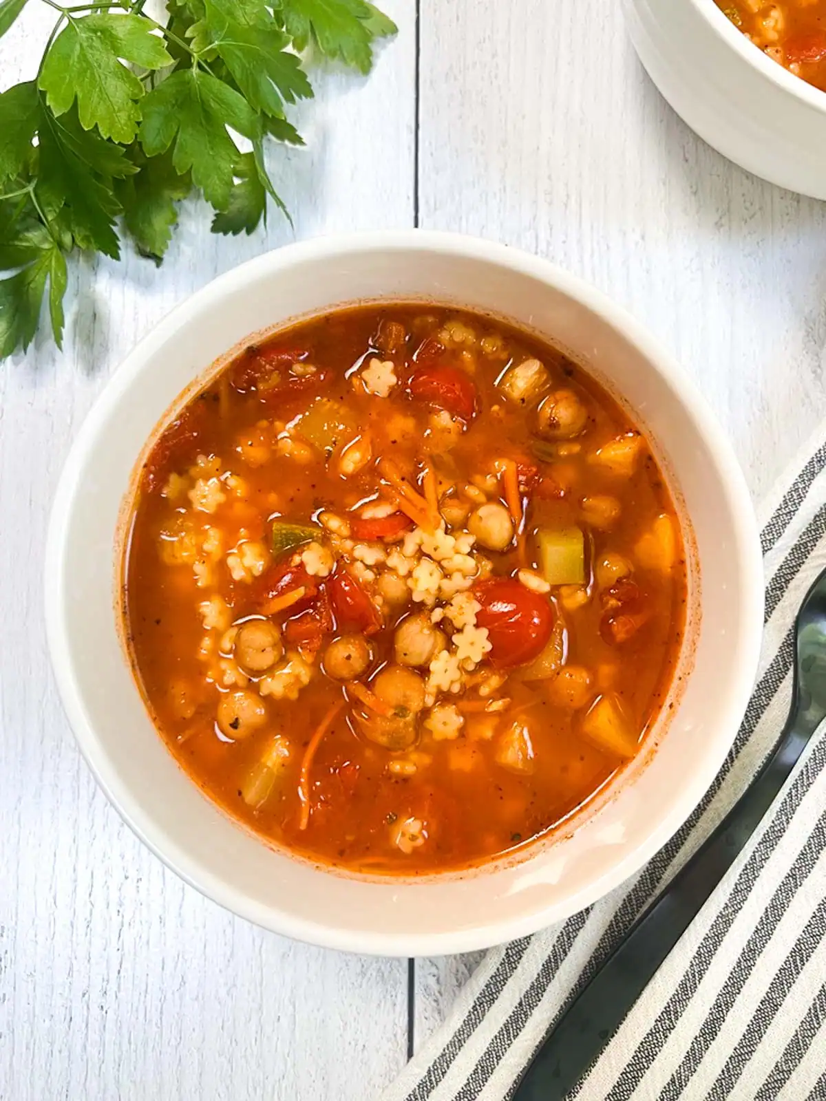Easy vegan minestrone soup in a white bowl.