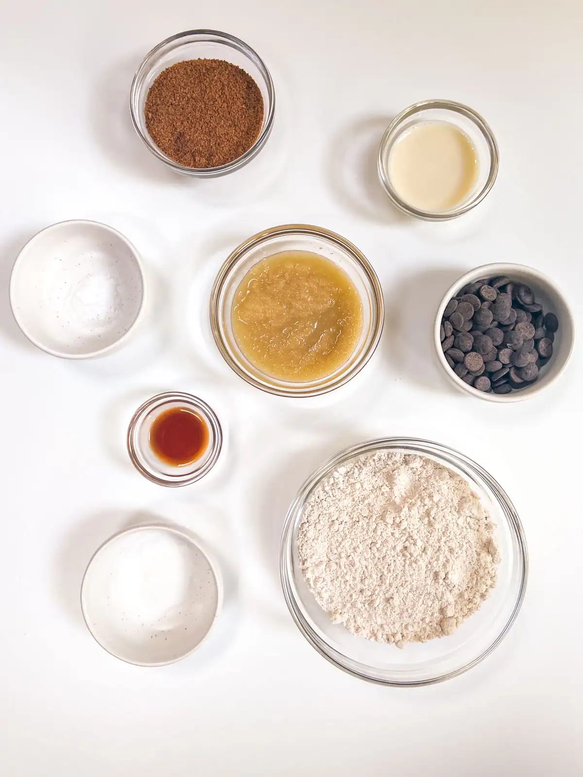 Ingredients for gluten-free vegan chocolate chip cookies in bowls.