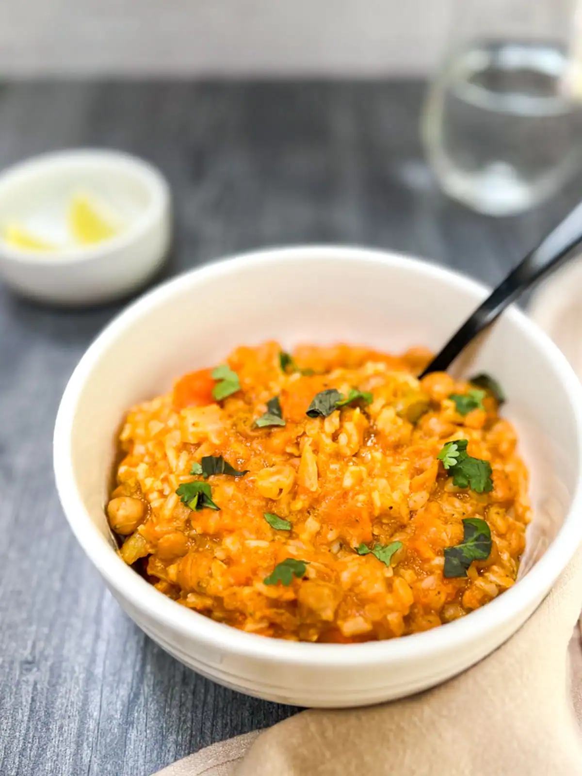 Creamy vegan Instant Pot red curry with chickpeas and rice in a bowl.