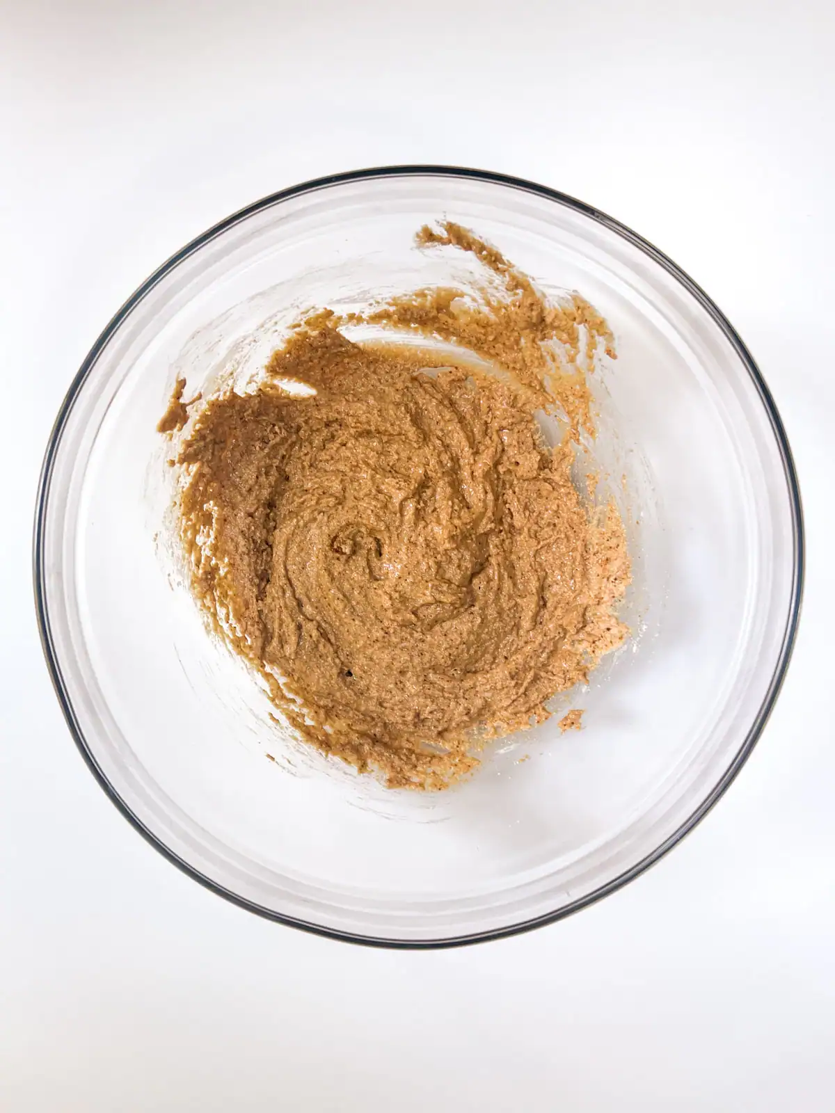 Wet ingredients for gluten-free vegan chocolate chip cookies in a glass bowl.