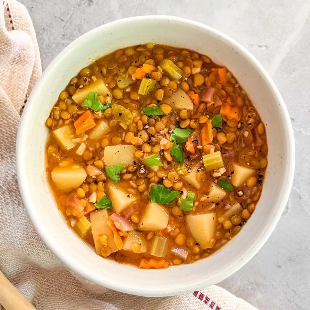 Instant Pot vegan lentil vegetable soup with carrots, celery, and potatoes.