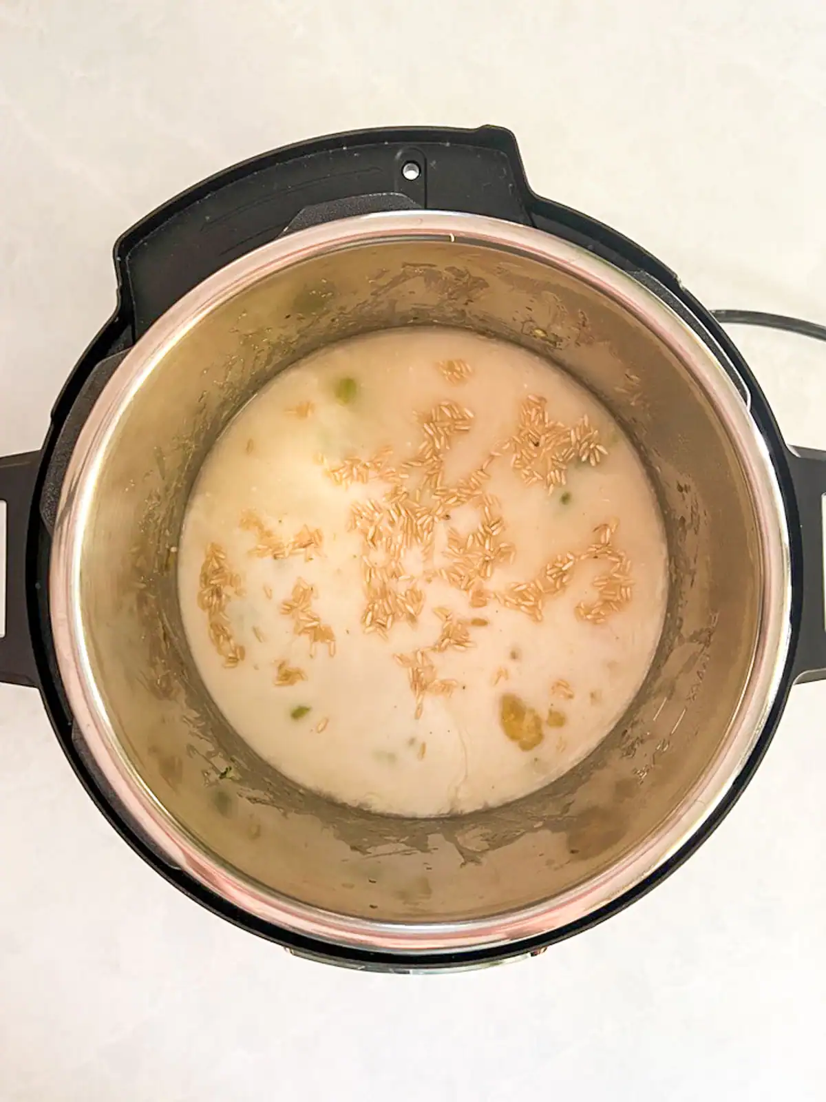 Instant Pot with rice and liquids added.