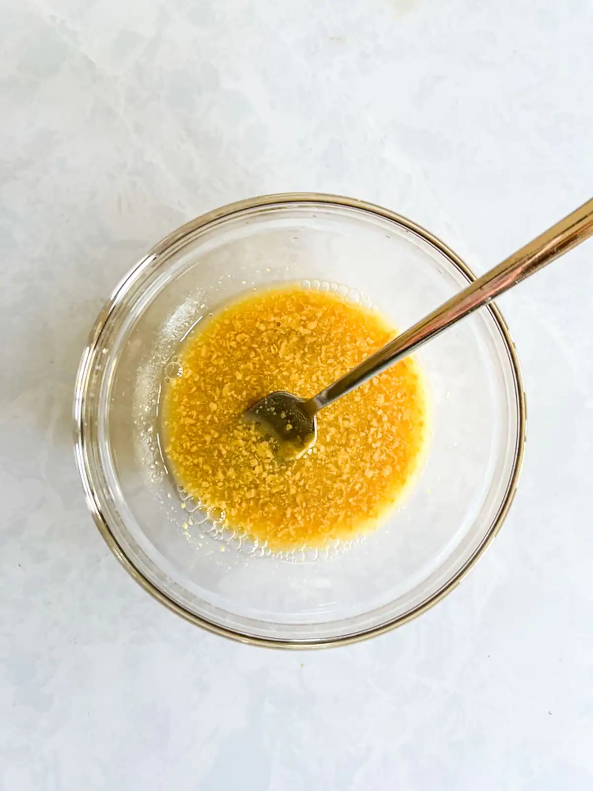 Apple cider vinaigrette in a glass bowl.