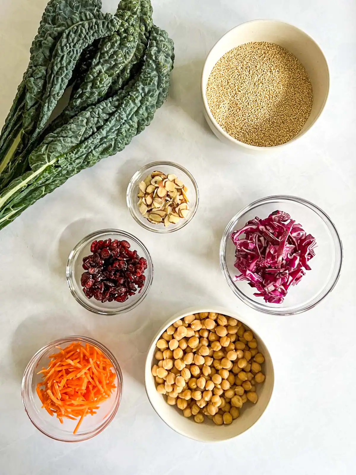 Ingredients for vegan quinoa kale salad with chickpeas and cranberries.