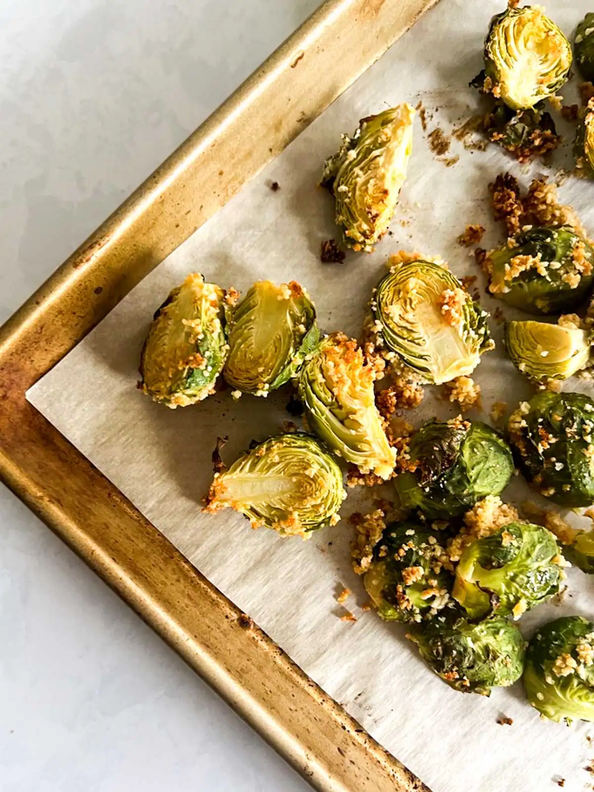 Crispy roasted Brussels sprouts on a baking sheet.