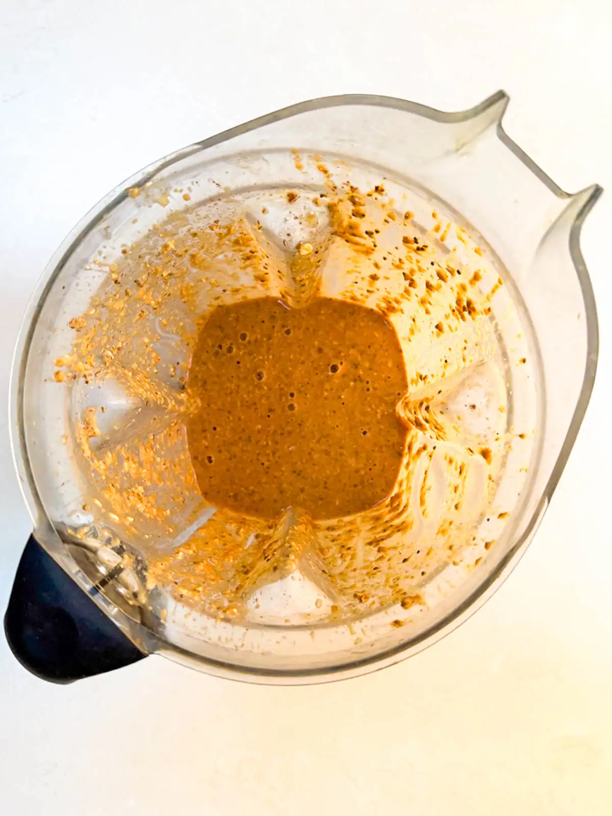Blended pumpkin spice overnight oats in a blender.