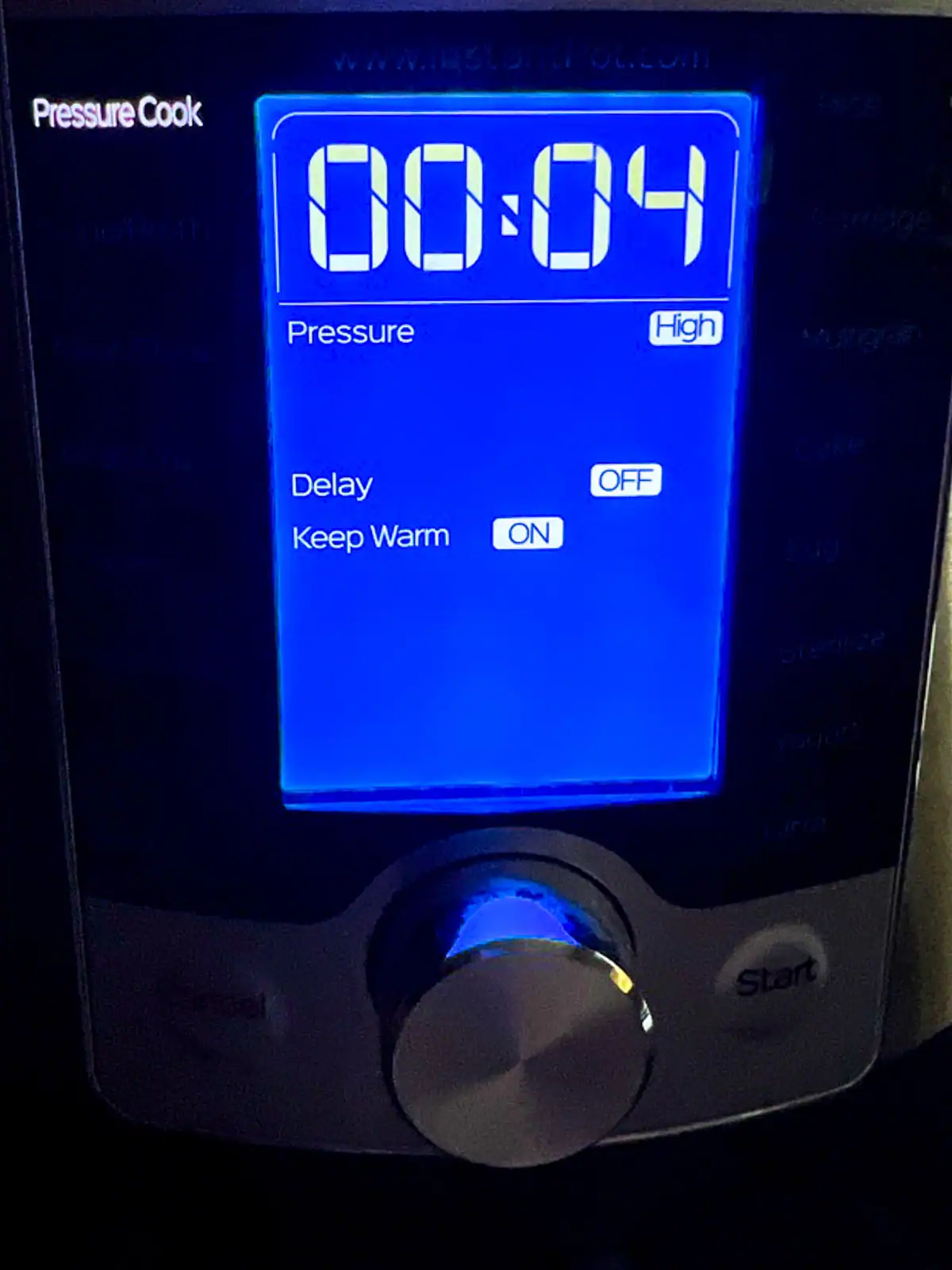 Pressure cooker digital control panel with timer set to 4 minutes.