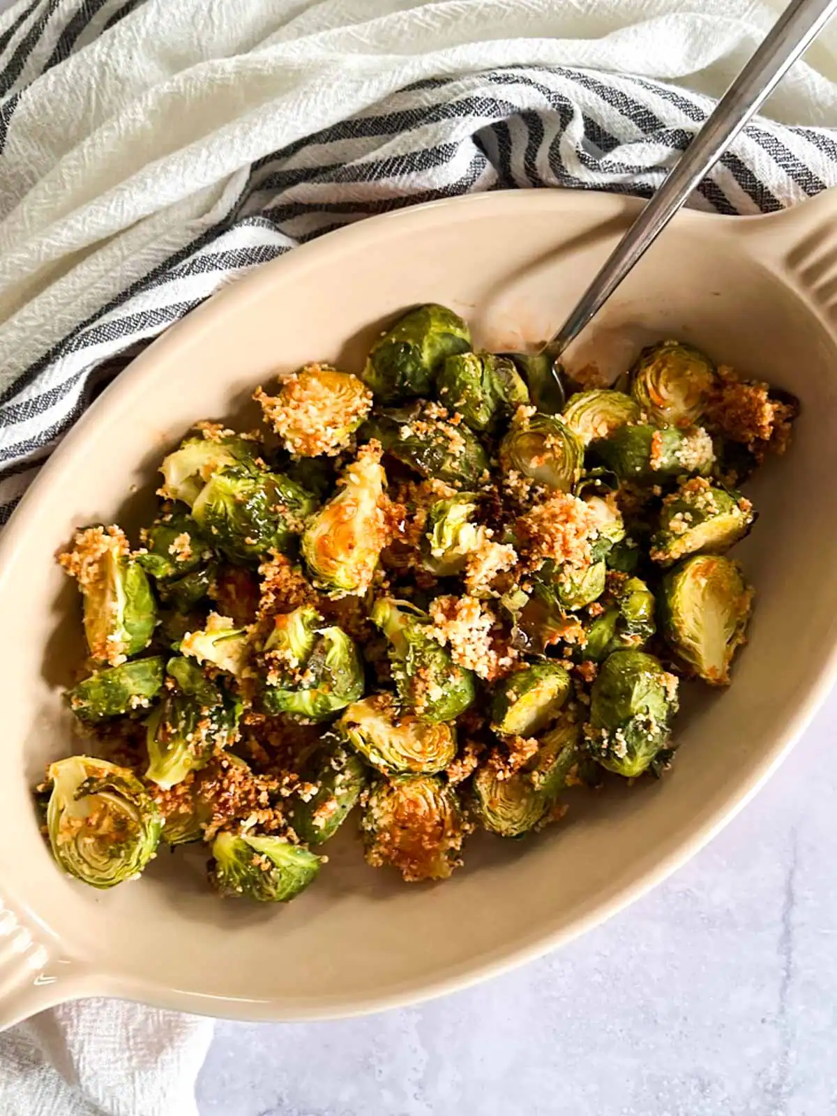 Crispy roasted Brussels sprouts drizzled with spicy maple glaze.