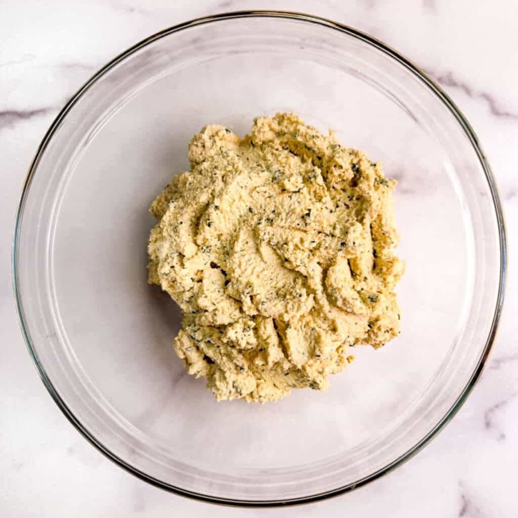 Oil-free vegan basil tofu ricotta in a glass bowl.