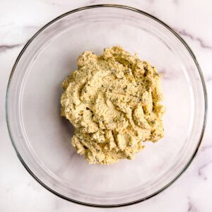 Oil-free vegan basil tofu ricotta in a glass bowl.