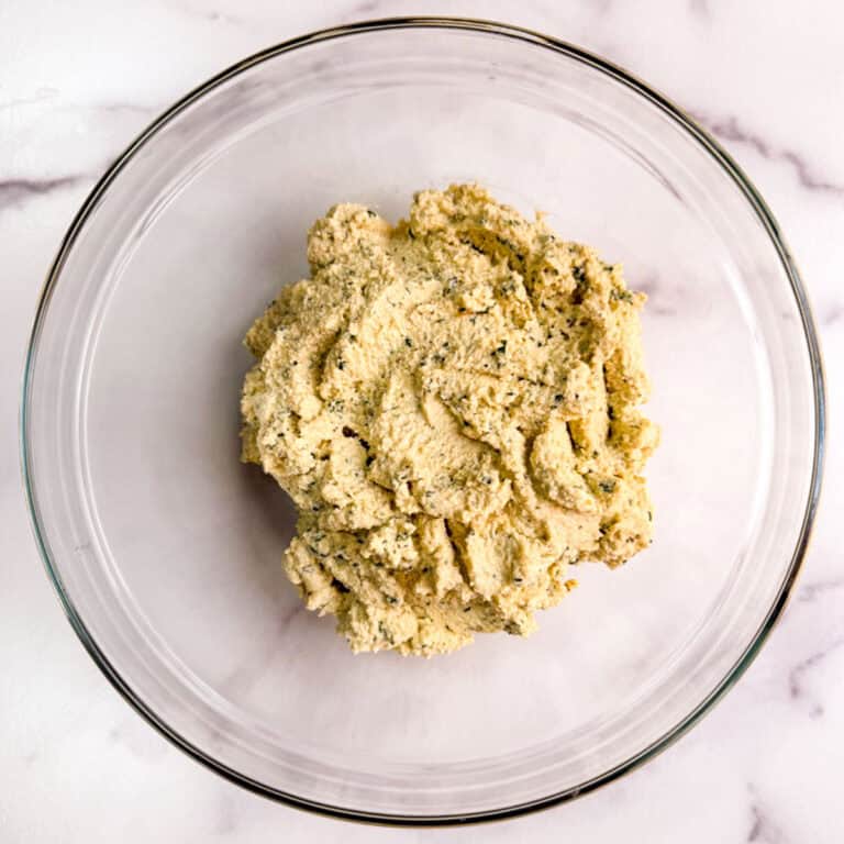 Oil-free vegan basil tofu ricotta in a glass bowl.