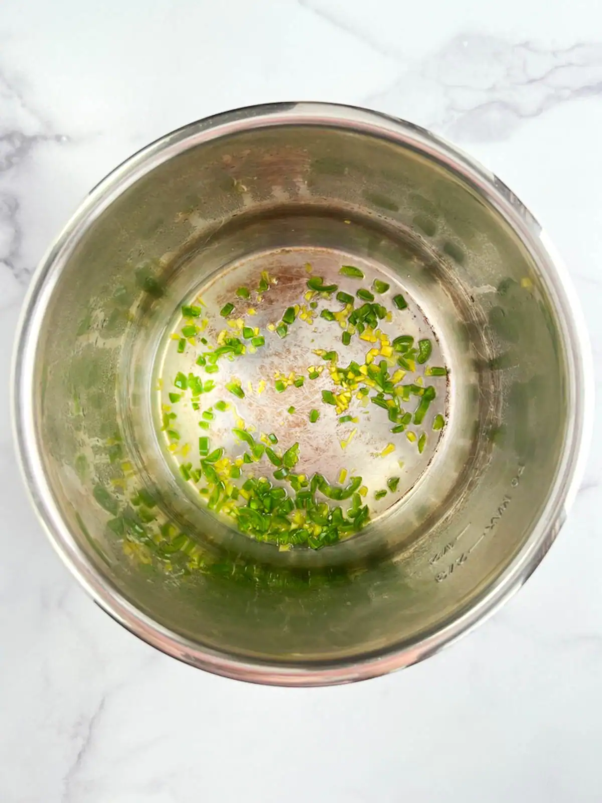 Diced pepper and ginger in an Instant Pot.