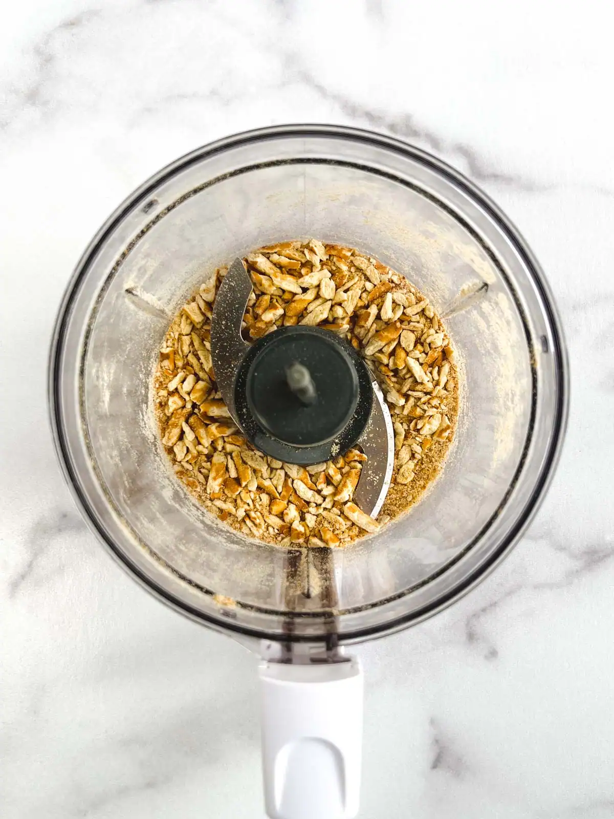 Chopped pretzels in a food processor.