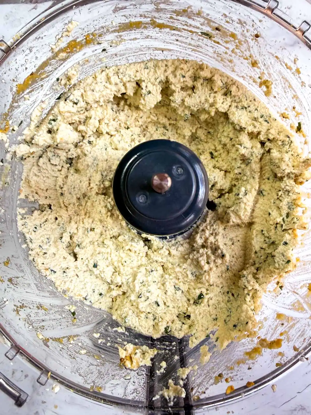 Vegan basil tofu ricotta in a food processor.