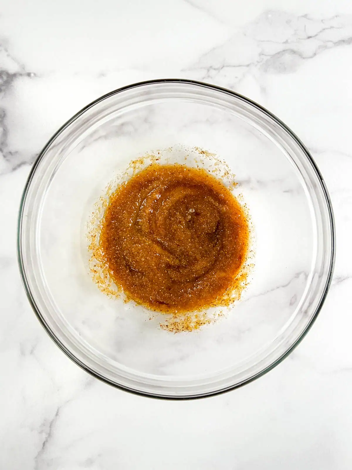 Wet ingredients for vegan ginger pear scones in a glass bowl.
