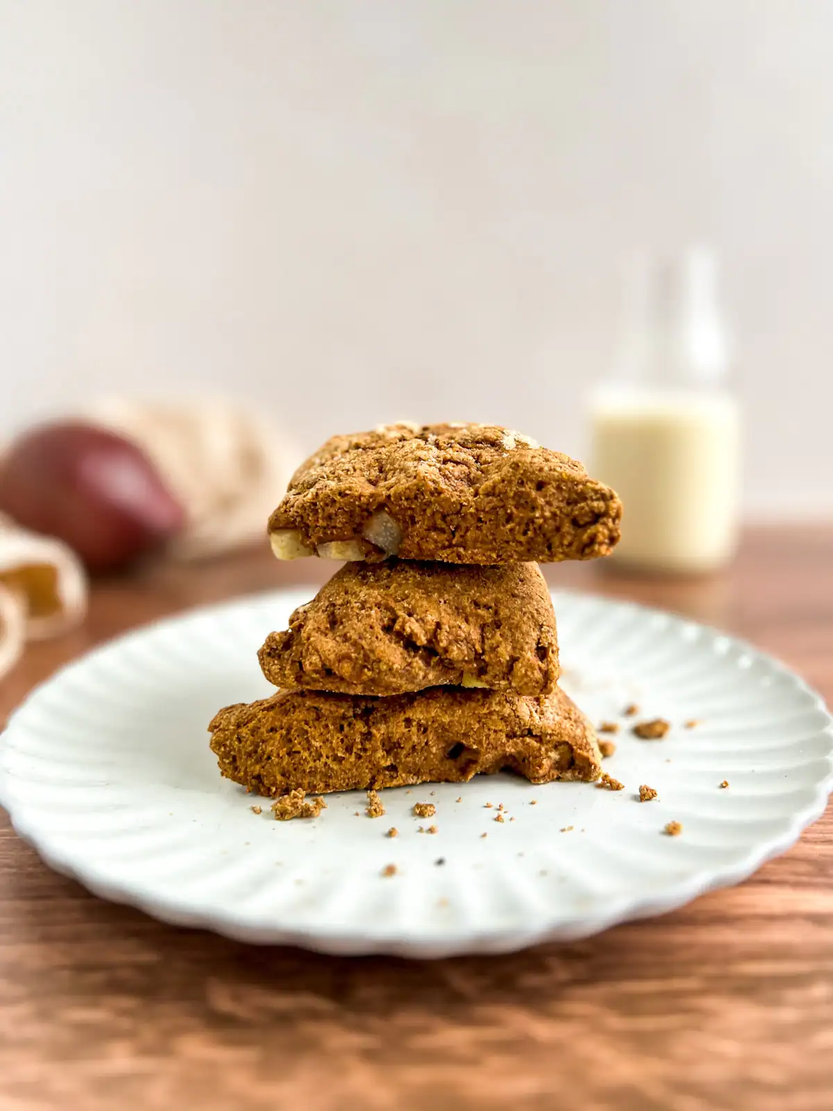 Vegan ginger pear scones stacked on a plate.