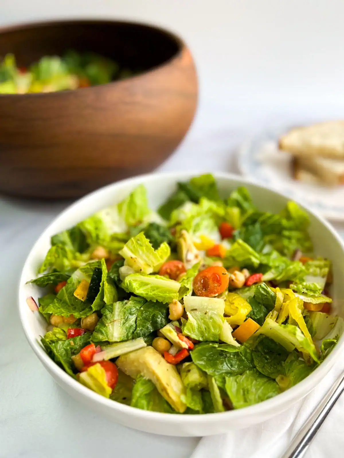 Italian chopped salad in a white bowl.