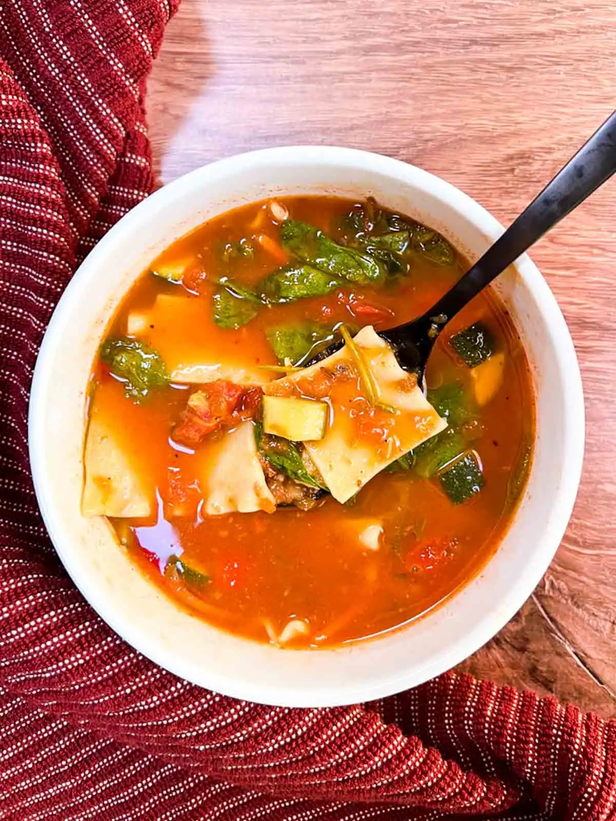 A bowl of spicy vegan lasagna soup.