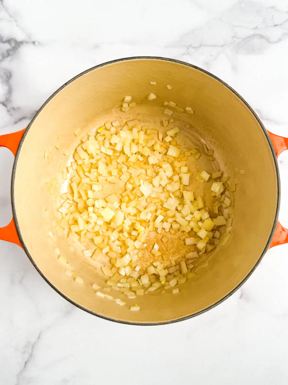 Diced onions sautéed in a Dutch oven.
