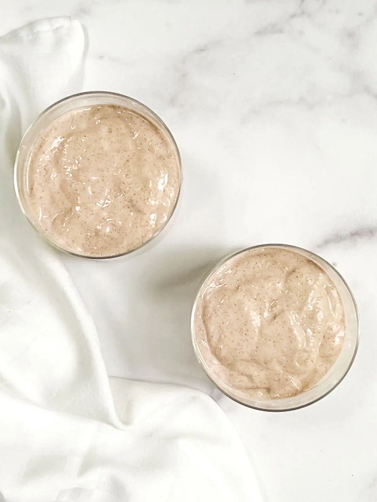 Blended strawberry overnight oats in glass containers.