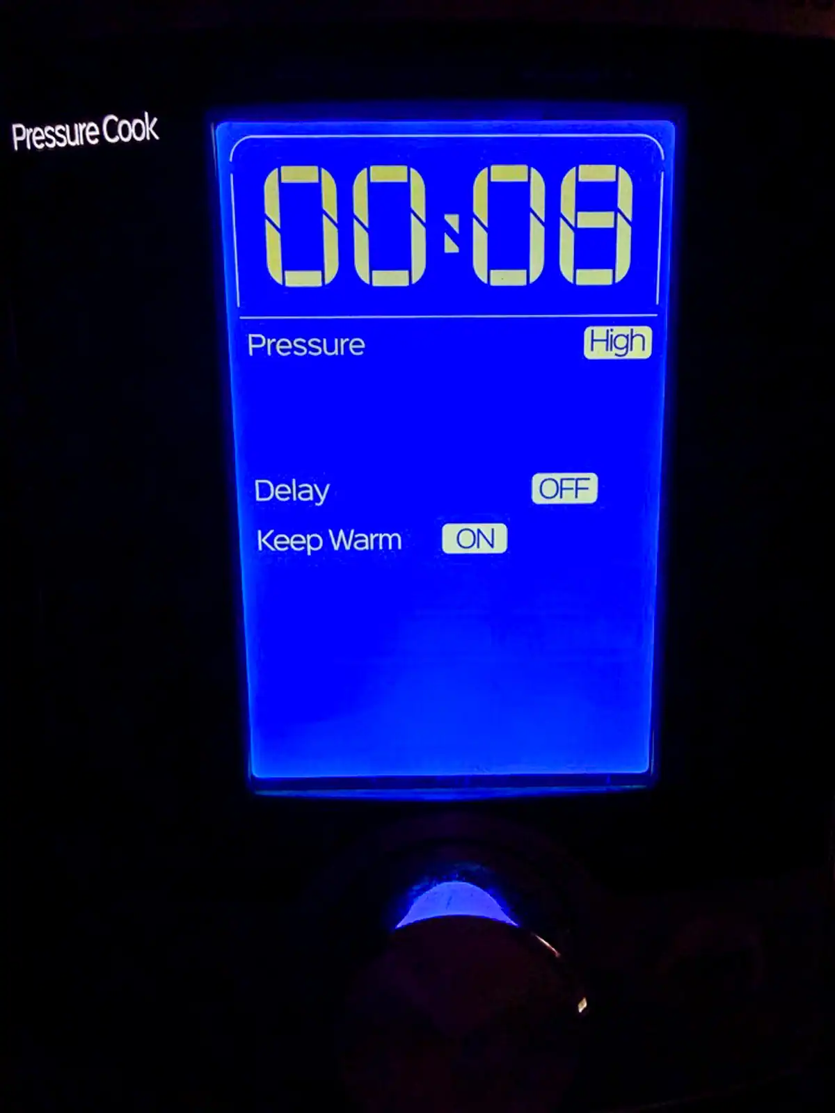 Control panel of Instant Pot set to Pressure Cook on High for 8 minutes.