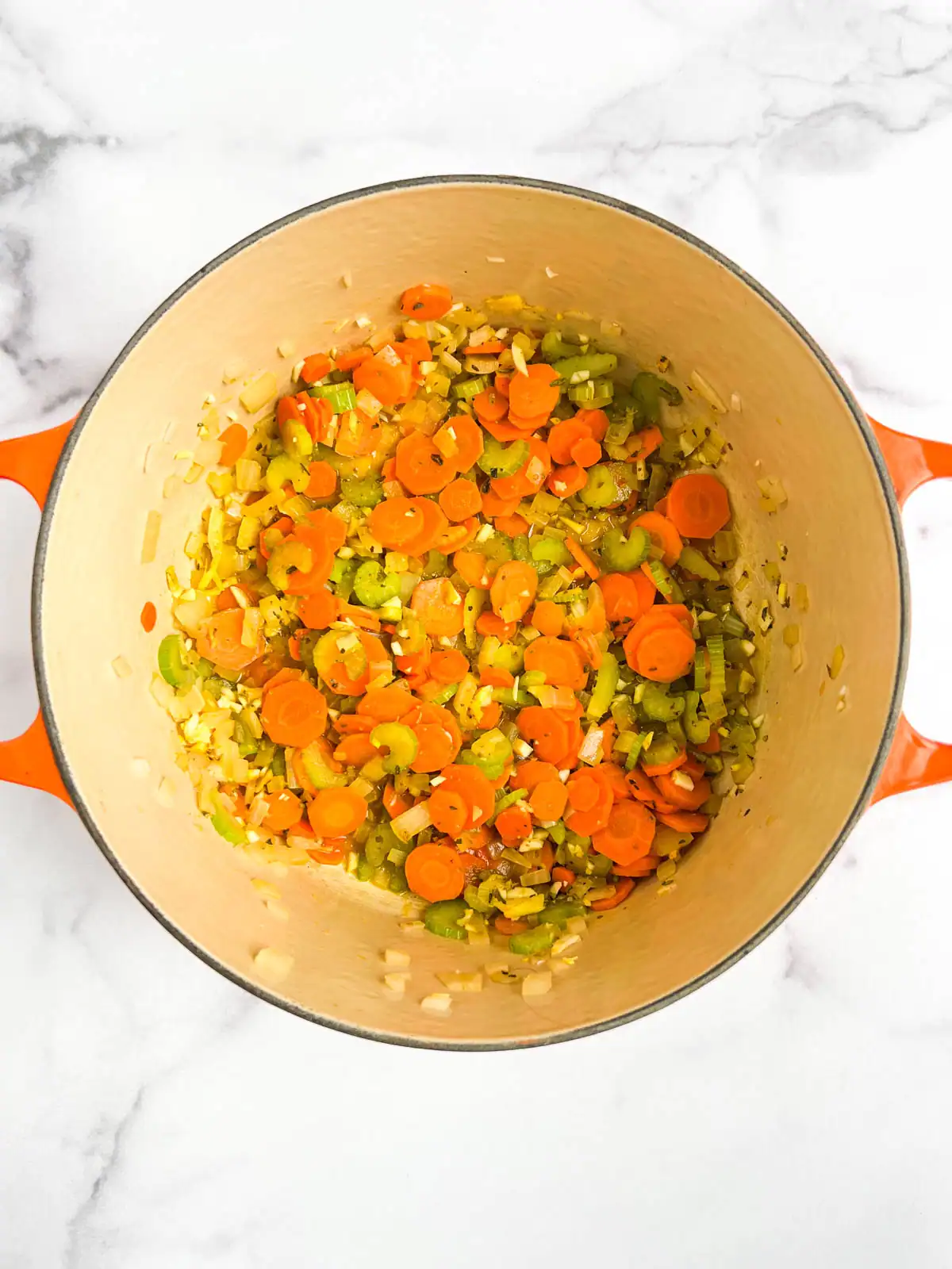 Cooked vegetables in a Dutch oven.
