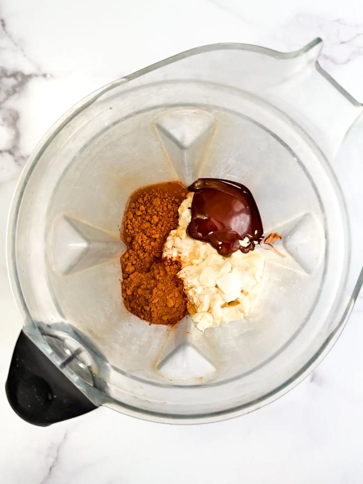 Ingredients for vegan chocolate mousse in a blender.