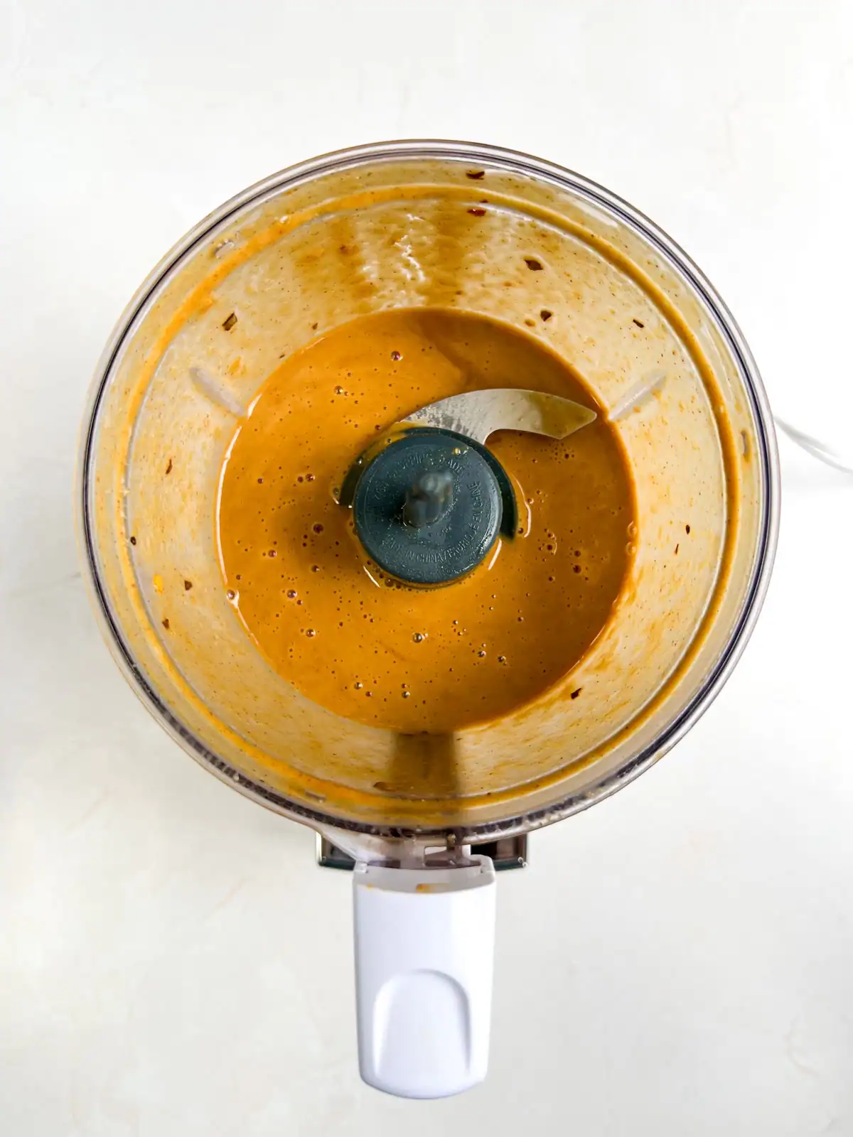 Thai-inspired peanut dressing in a food processor.