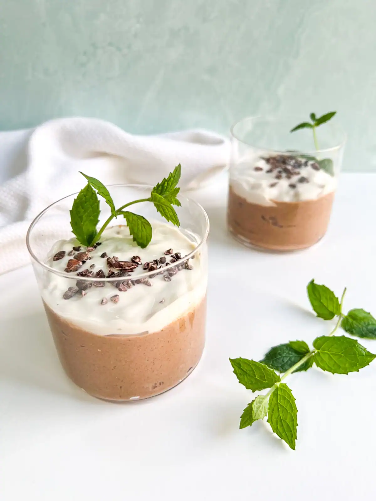 Mint chocolate blended overnight oats garnished with mint leaves.