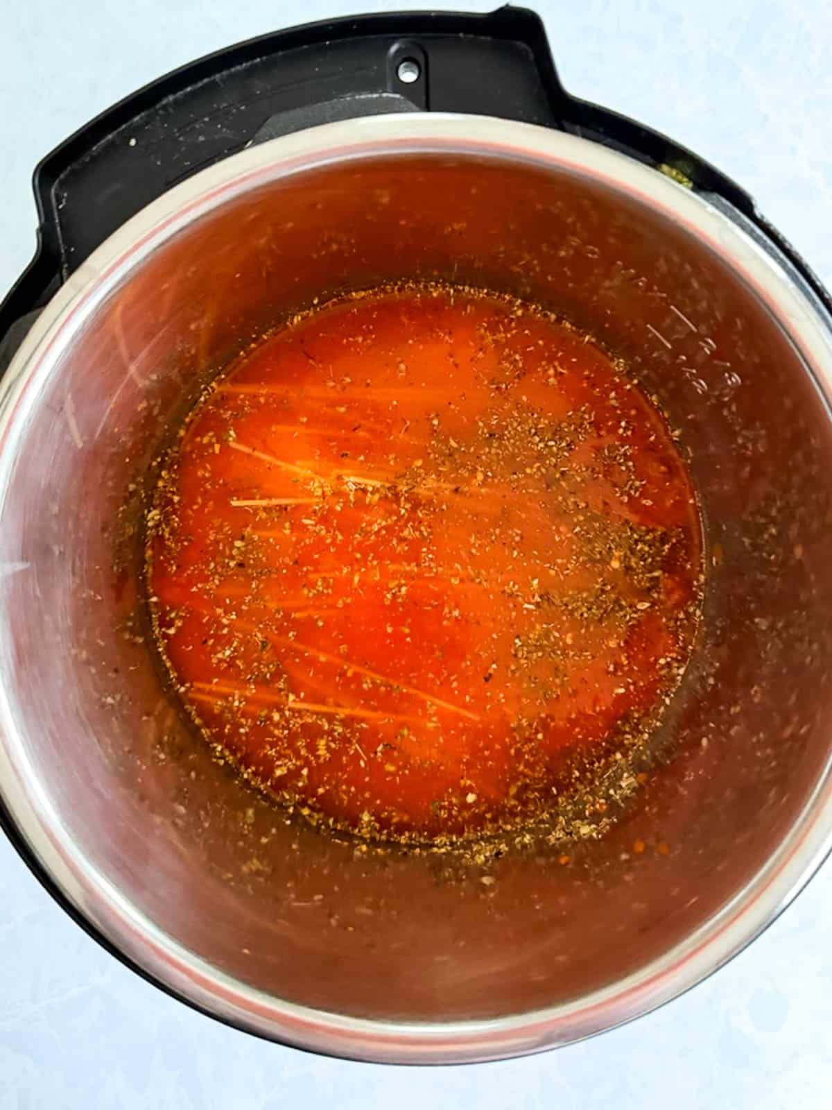 Ingredients for Instant Pot spaghetti in a Instant Pot.