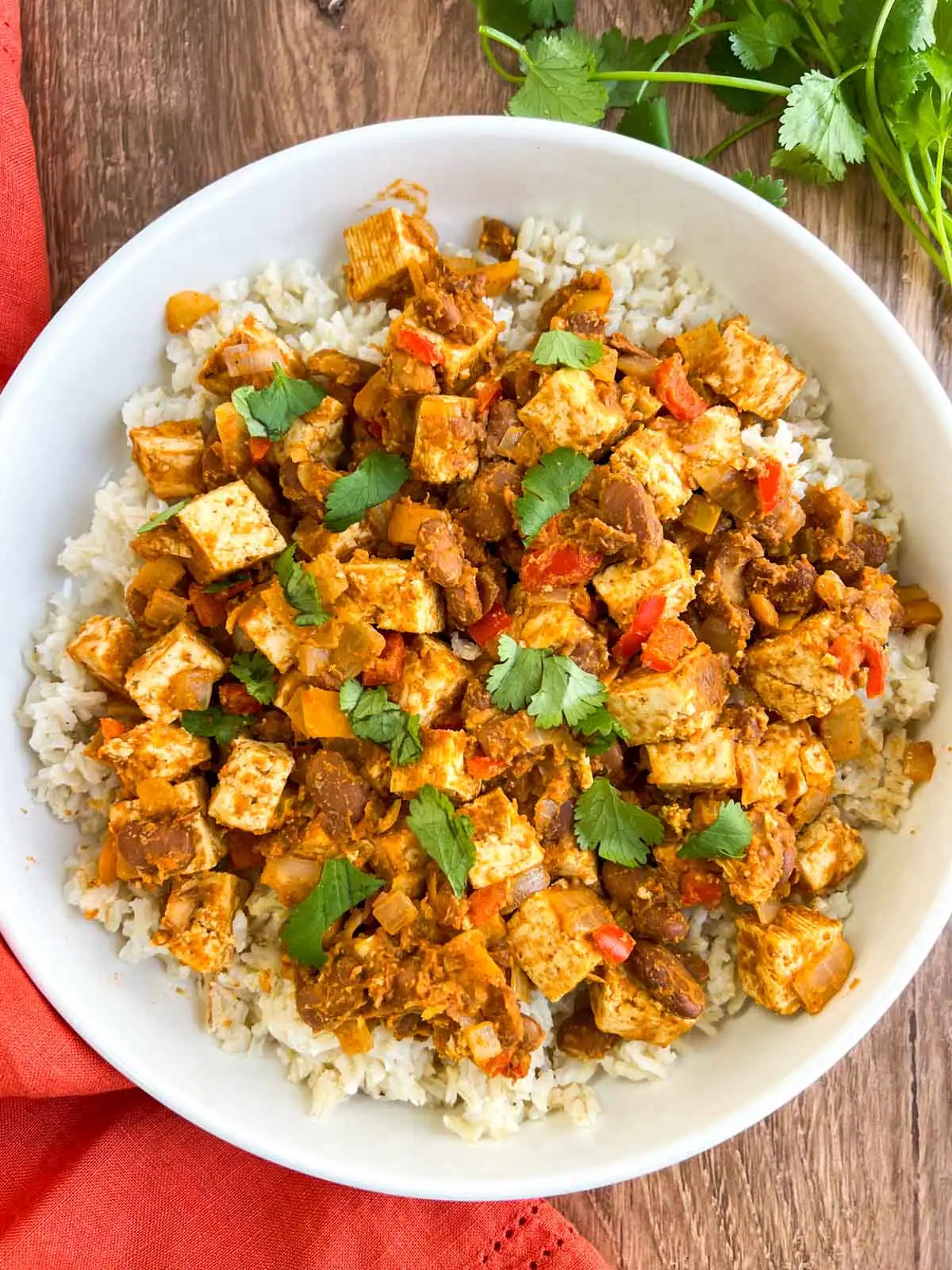 Tex-Mex skillet with tofu and pinto beans on a white plate.