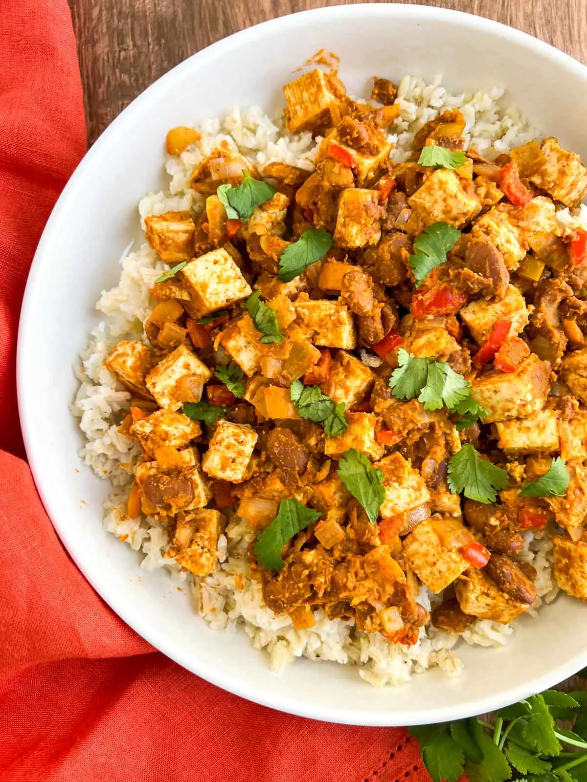 Tex-Mex skillet with tofu and pinto beans on a white plate.