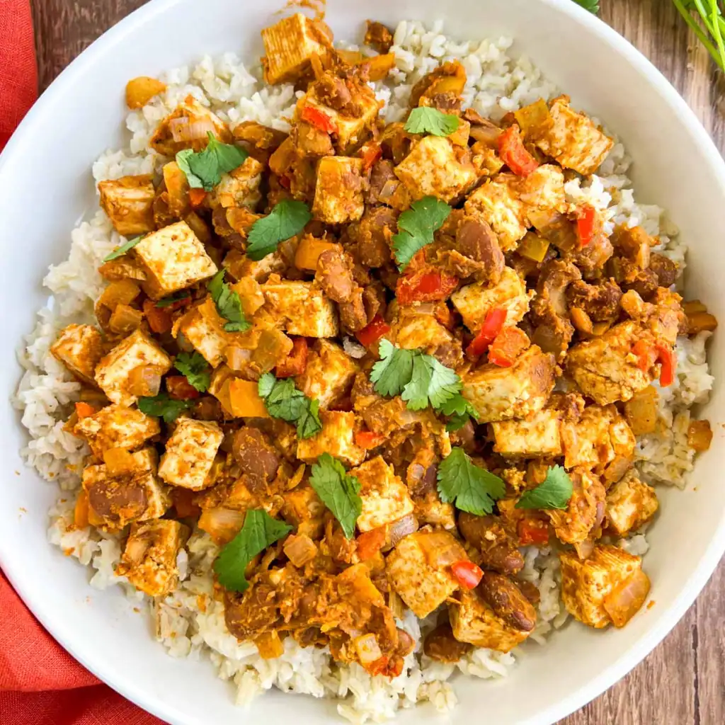 Tex-Mex skillet with tofu and pinto beans on a white plate.