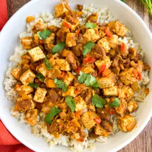 Tex-Mex skillet with tofu and pinto beans on a white plate.