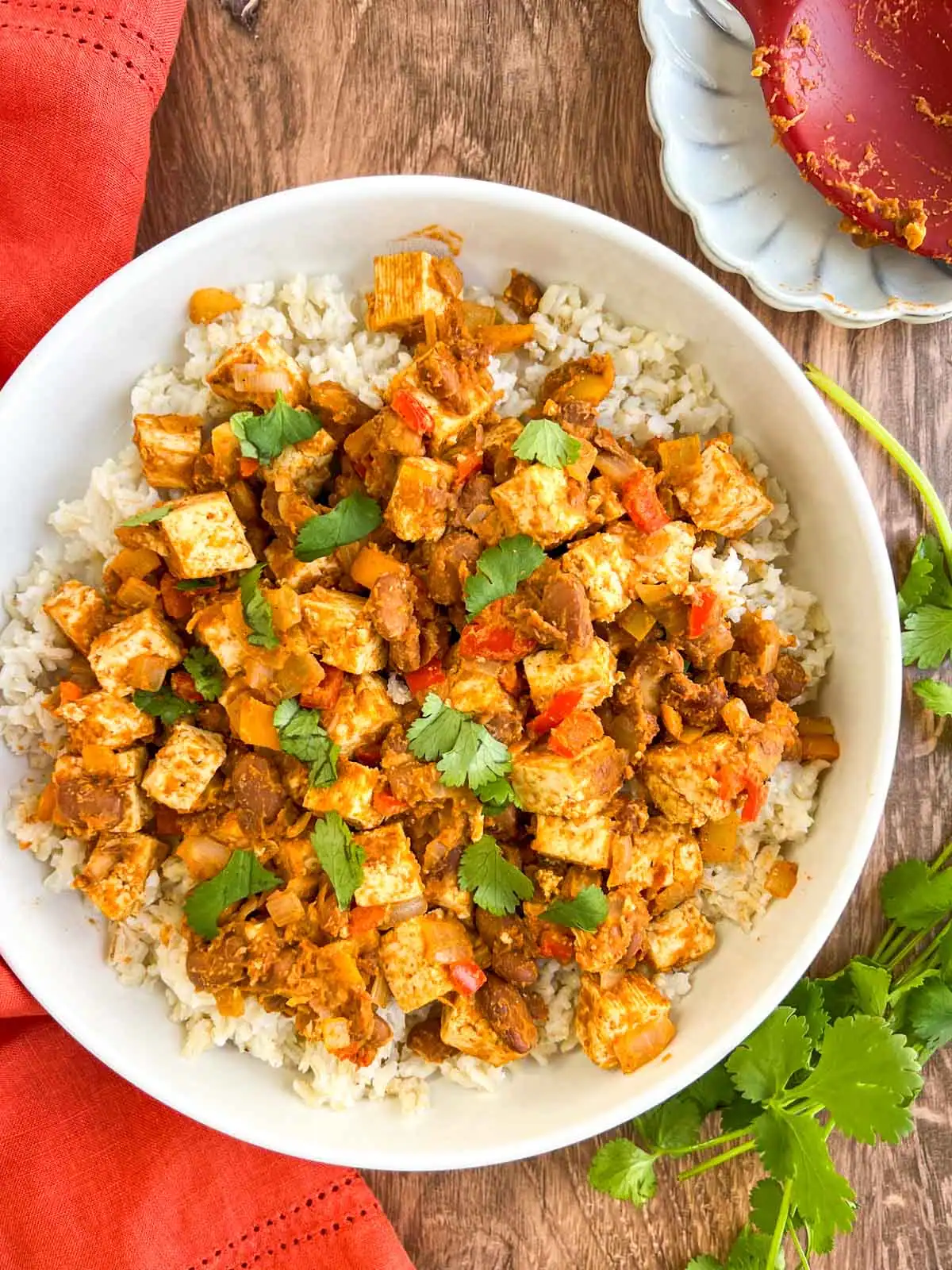 Tex-Mex skillet with tofu and pinto beans on a white plate.