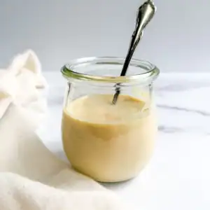 Vegan Caesar dressing in a glass jar.