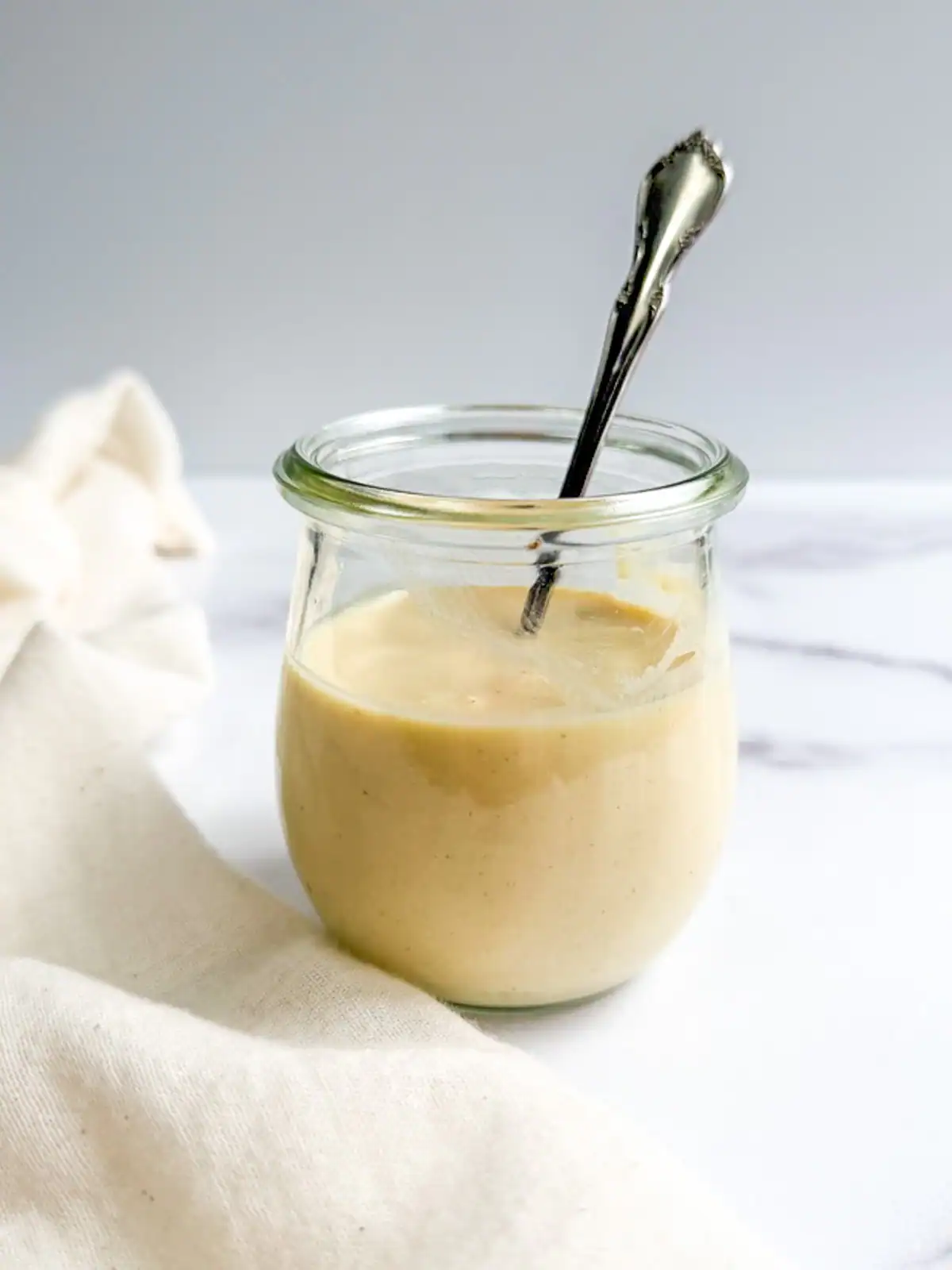 Vegan Caesar dressing in a glass jar.