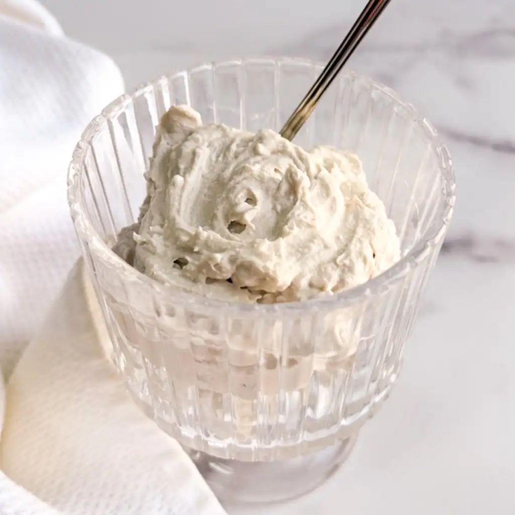 Vegan coconut whipped cream in a glass.