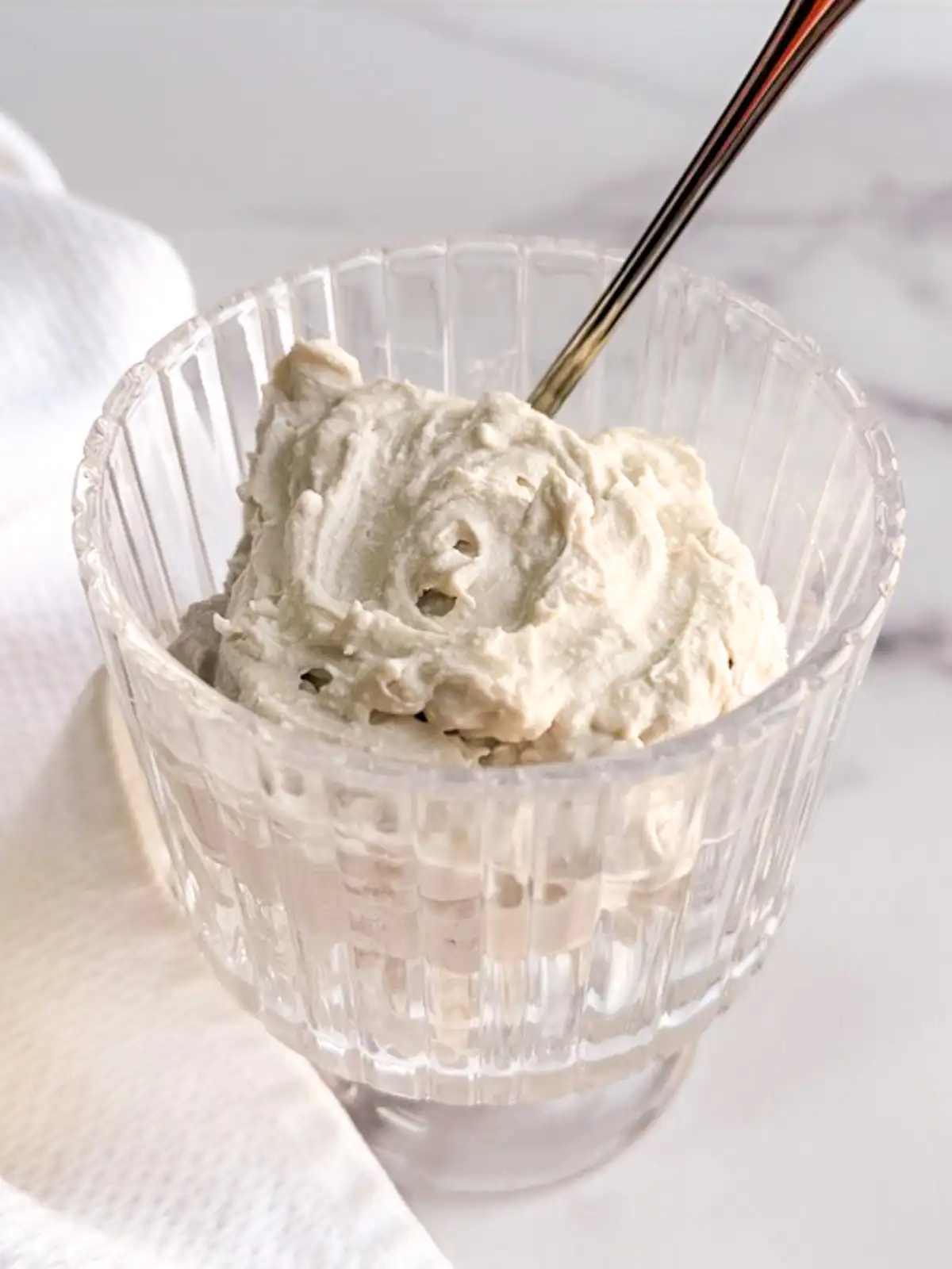 Vegan coconut whipped cream in a glass.